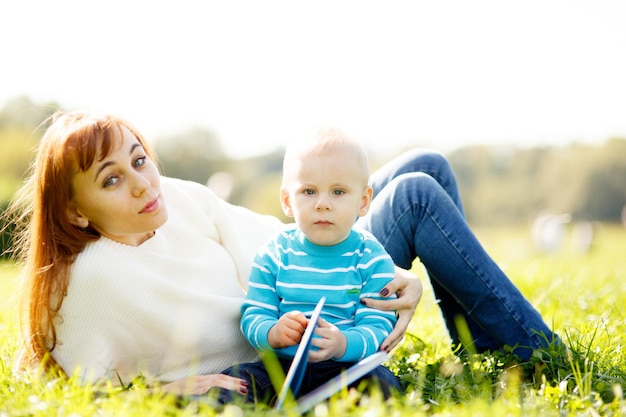 Mother with boy reading book