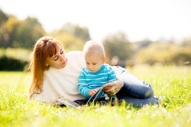 Mother with boy reading book