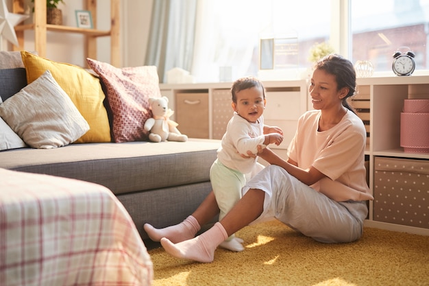 Mother with child in the living room