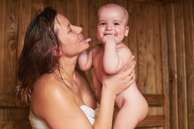 Mother with a child in a sauna