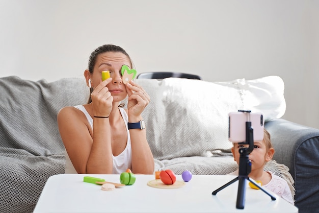 Mother with child streaming online video