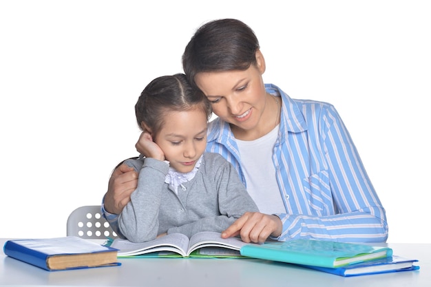 Mother with daughter doing homework