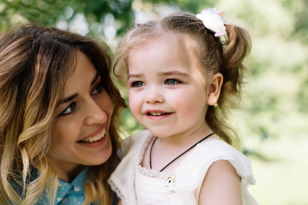 Mother with daughter smiling portrait