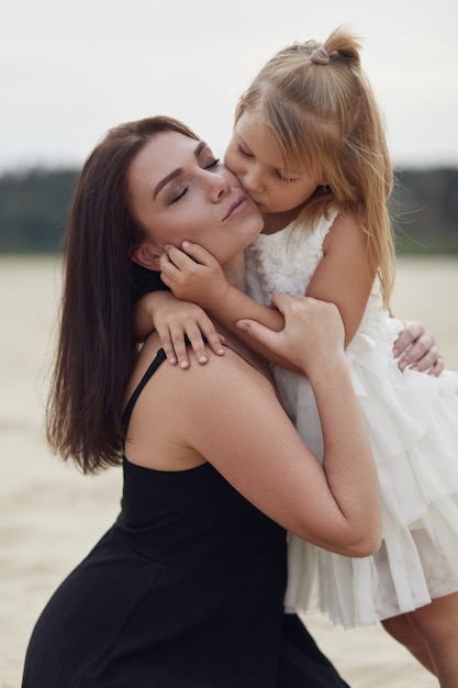 Mother with daughter walk on nature