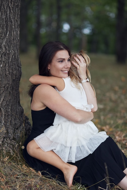 Mother with daughter walk on nature