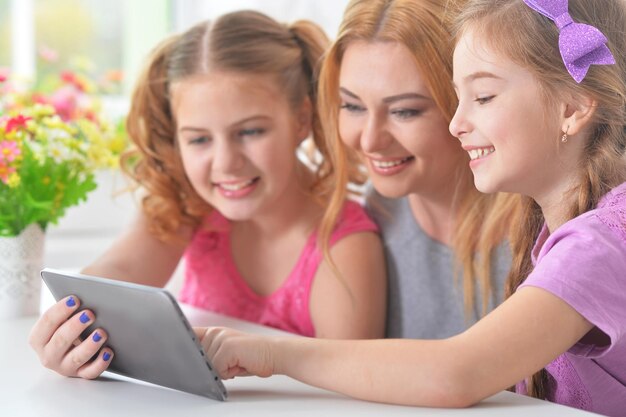 Mother with daughters reading