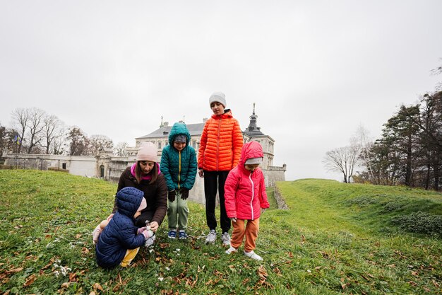 Mother with four kids visit Pidhirtsi Castle Lviv region Ukraine Family tourist