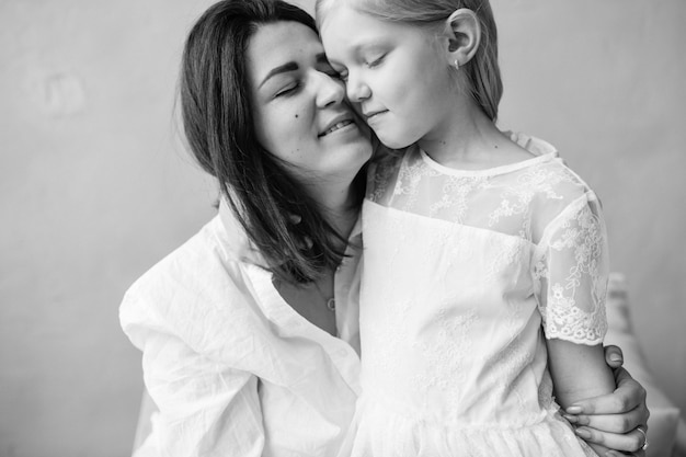 Mother with her little daughter black and white portrait