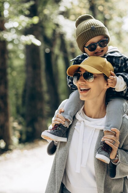 Mother with her little son having fun together in park