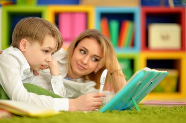 Mother with her son doing homework at home