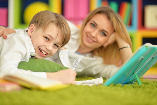 Mother with her son doing homework