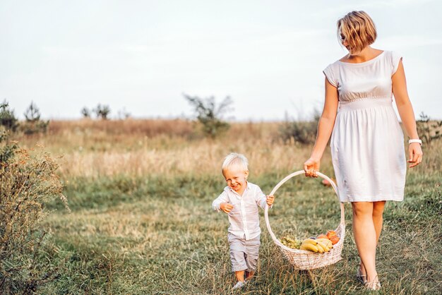 Mother with her son on picnic outdoor