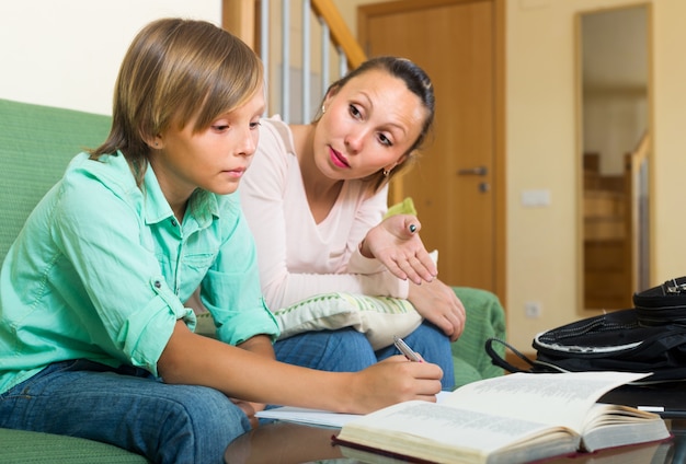 Mother with son doing homework