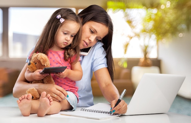 Mother working with child