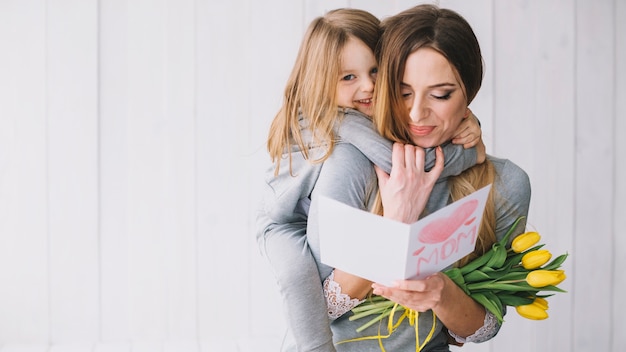 Mothers day concept with happy mother and daughter