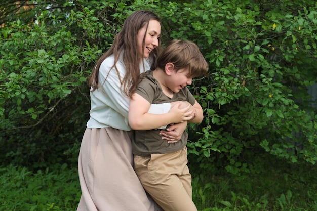 Mothers embrace amid green trees speaks volumes about family bonds and the beauty of maternal love