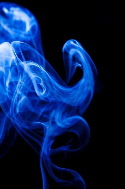 Motion blue smoke on black background.