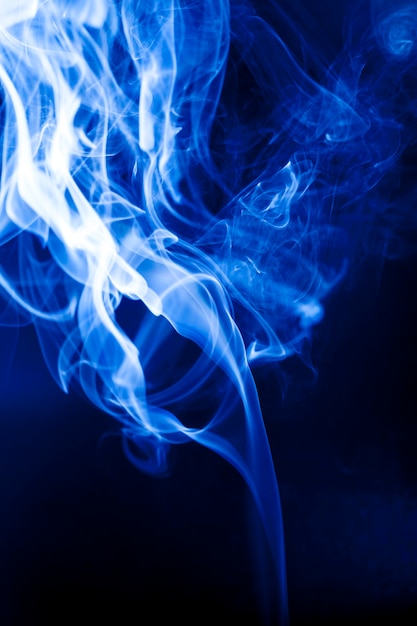 Motion blue smoke on black background.