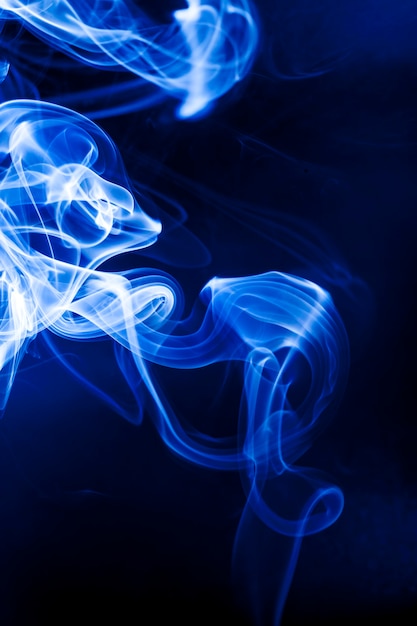 Motion blue smoke on black background.