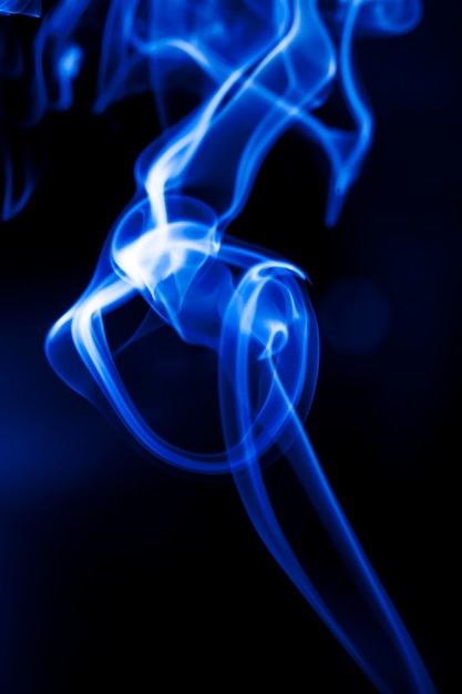 Motion blue smoke on black background.