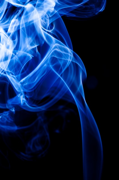 Motion blue smoke on black background.