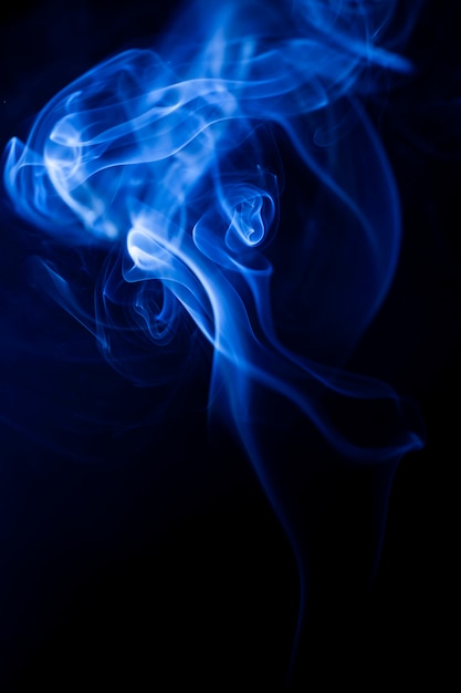 Motion blue smoke on black background.