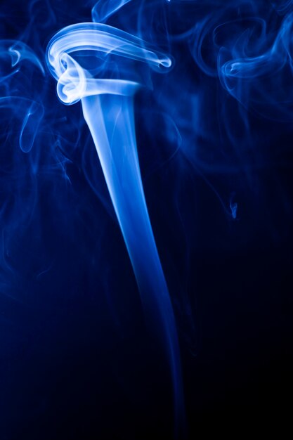 Motion blue smoke on black background.