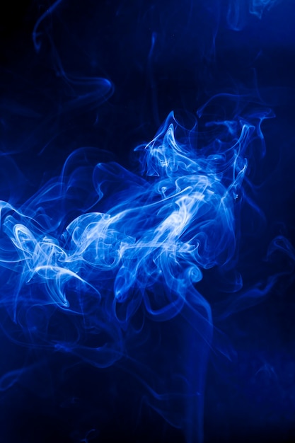 Motion blue smoke on black background.