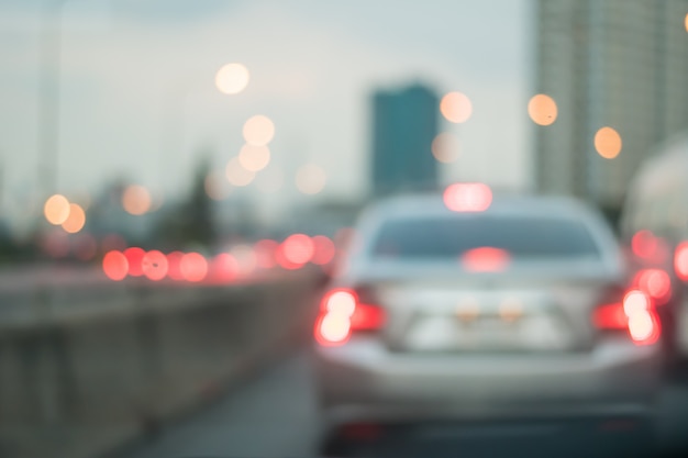 Photo motion blur of car on the road with abstract light bokeh in the evening