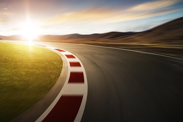 Motion blurred racetrack with mountain background warm mood