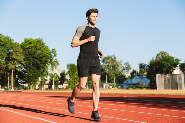 Motivated young sportsman running