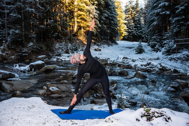 Photo motivation yoga on the wild nature near the river