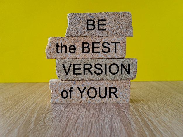 Photo motivational and inspirational symbol concept words be the best version of you on brick blocks