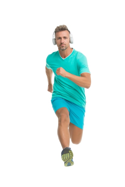 Motivational song. Man sportsman running with headphones. Runner handsome strong guy in motion isolated on white. Music fuel for workout training. Run faster. Running sport. Keep running every day.