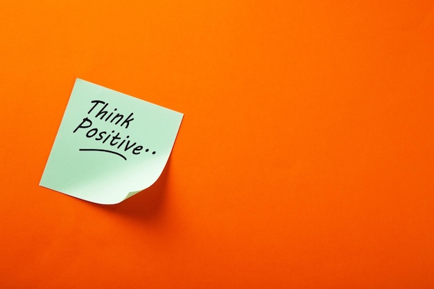 Motivational think positive word on note pads