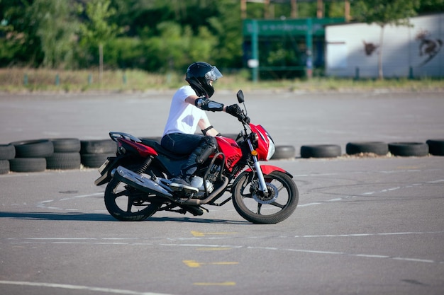 Moto school track driving a biker on a motorcycle