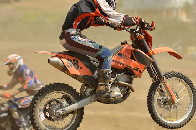 Photo motocross bike in a race representing concept of speed and power in extreme man sport