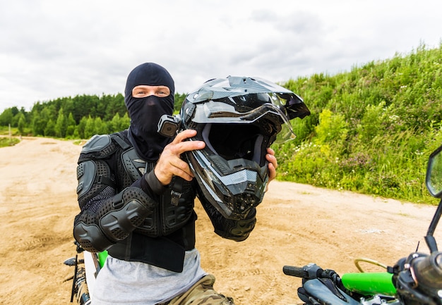 Photo motocross racers on landscape