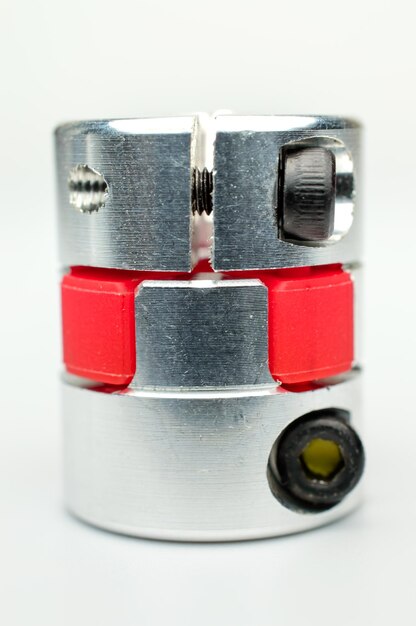 Motor coupling to reduce vibration and smooth start and running of mechanism on a white background.