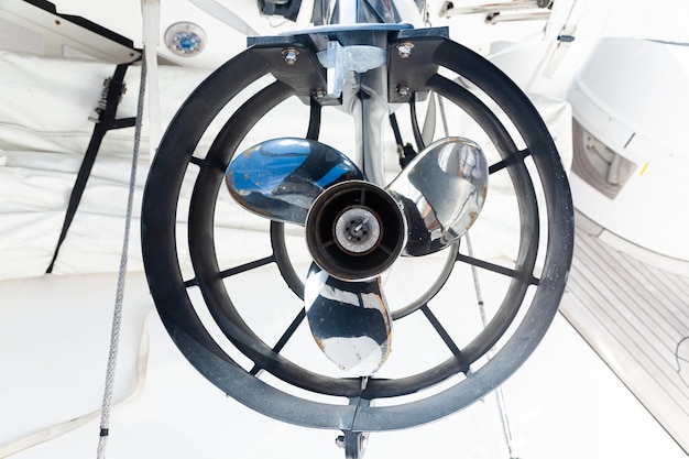 Motor propeller for motor yachts and boats in a protective steel casing on a boat closeup