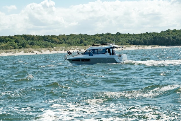 Motor yacht in the sea ocean yacht on blue waves