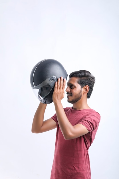 Motorbike concept young man with black helmet on white background