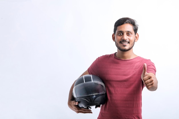 Motorbike concept Young man with black helmet on white background.