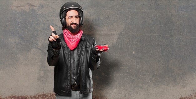 Motorbike rider holding a red car model