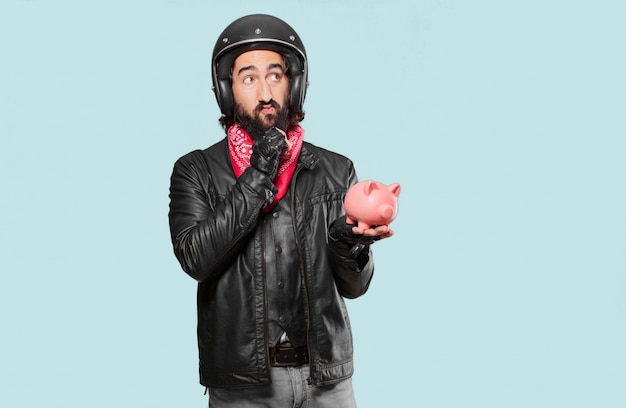 Motorbike rider with a piggybank