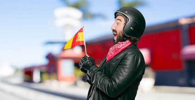 Pilota di moto con una bandiera della spagna