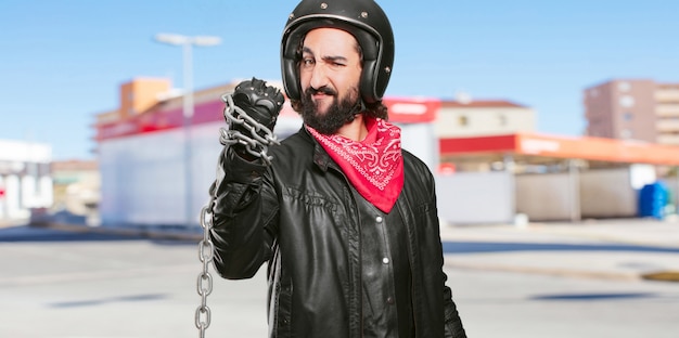 Motorbike rider with a steel chain