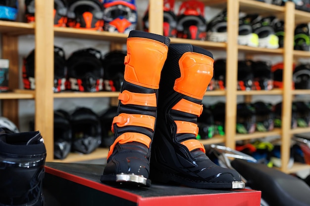 Photo motorcycle equipment in the form of boots in a motorcycle shop