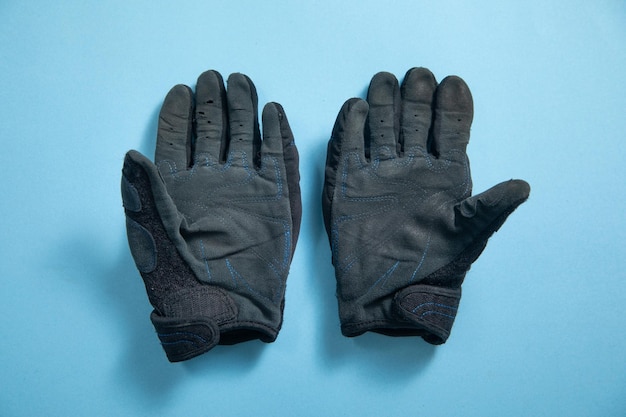 Motorcycle gloves on the blue background