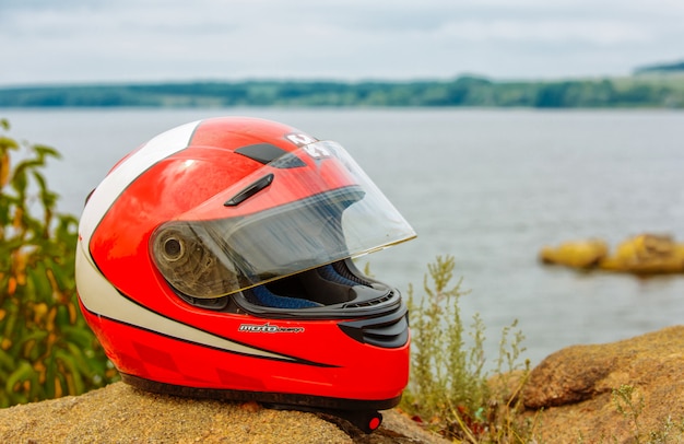 Motorcycle helmet on the background of nature